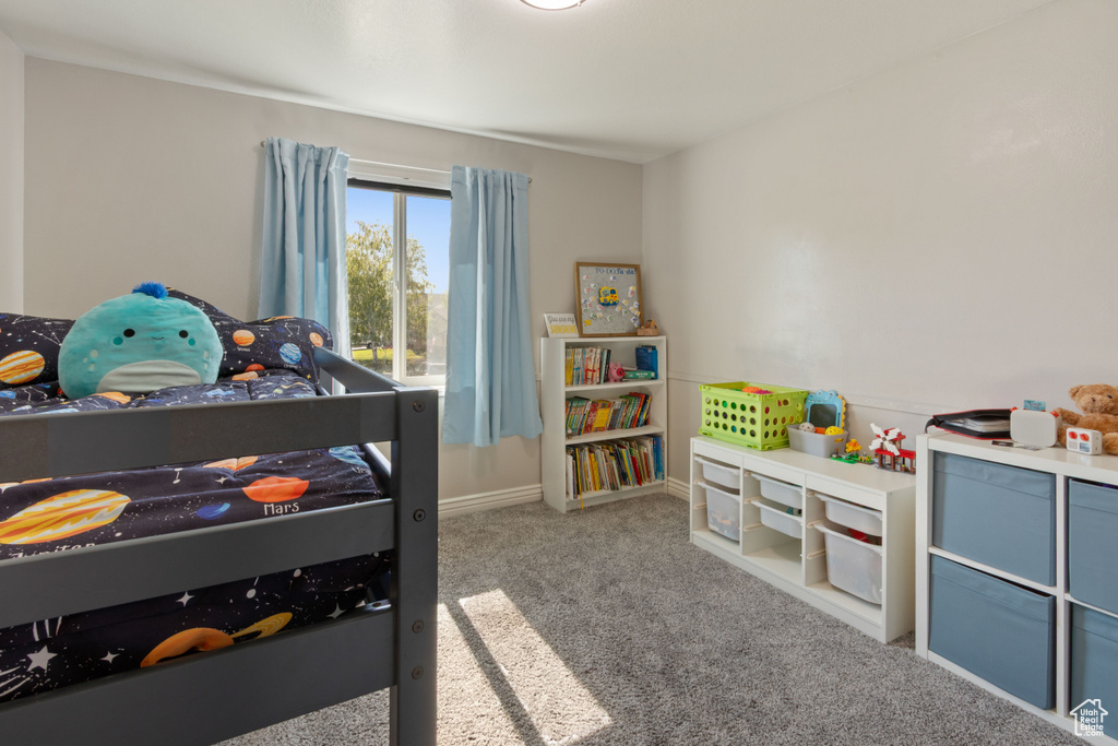 Bedroom with carpet and baseboards