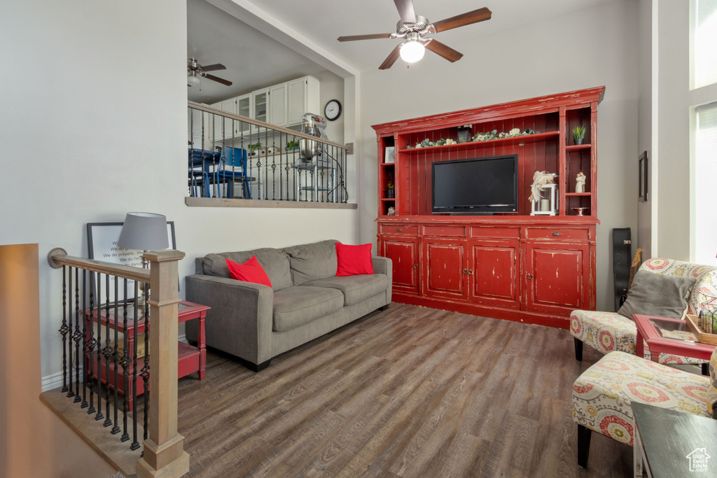 Living room featuring ceiling fan and wood finished floors