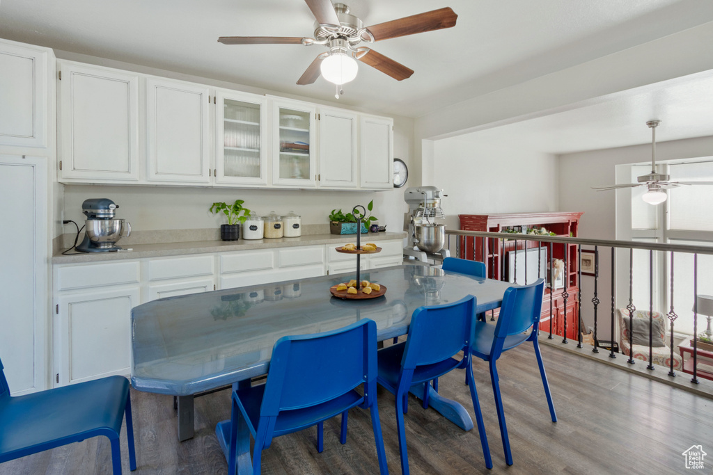 Dining room with a ceiling fan and light wood finished floors