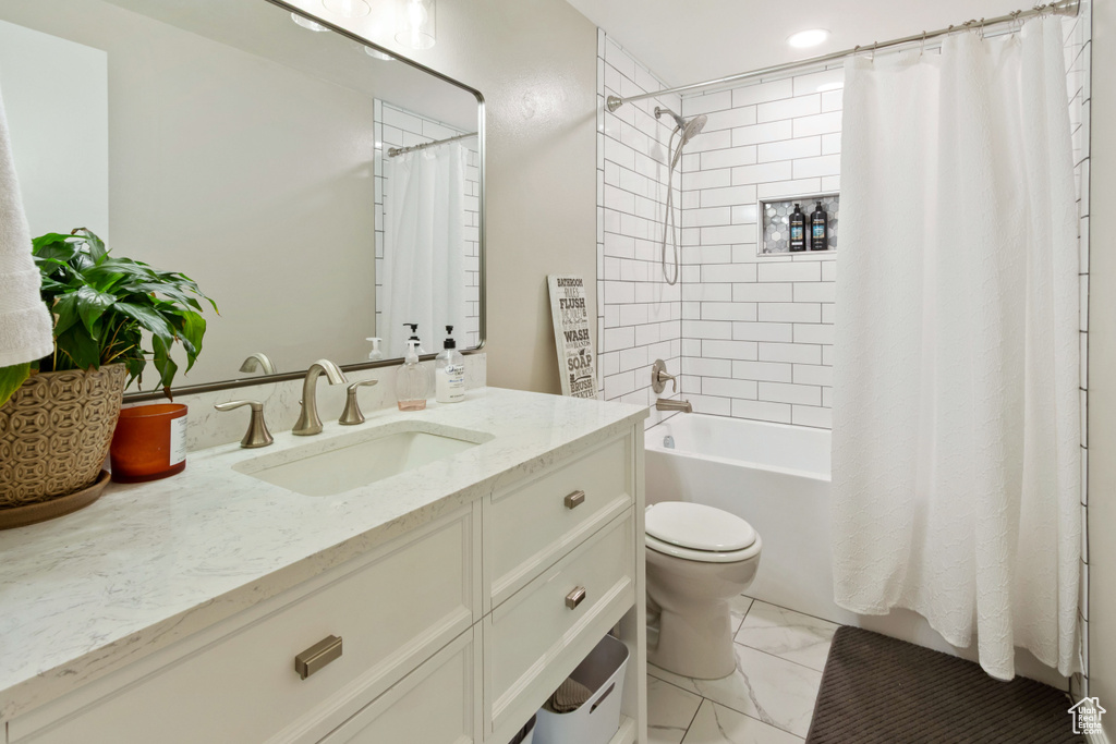 Full bath with vanity, toilet, shower / bathtub combination with curtain, and marble finish flooring