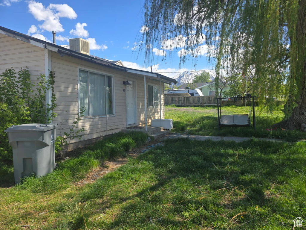 View of yard with central AC unit