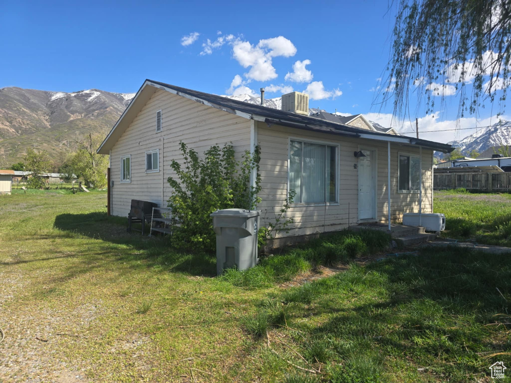 View of side of home featuring a mountain view