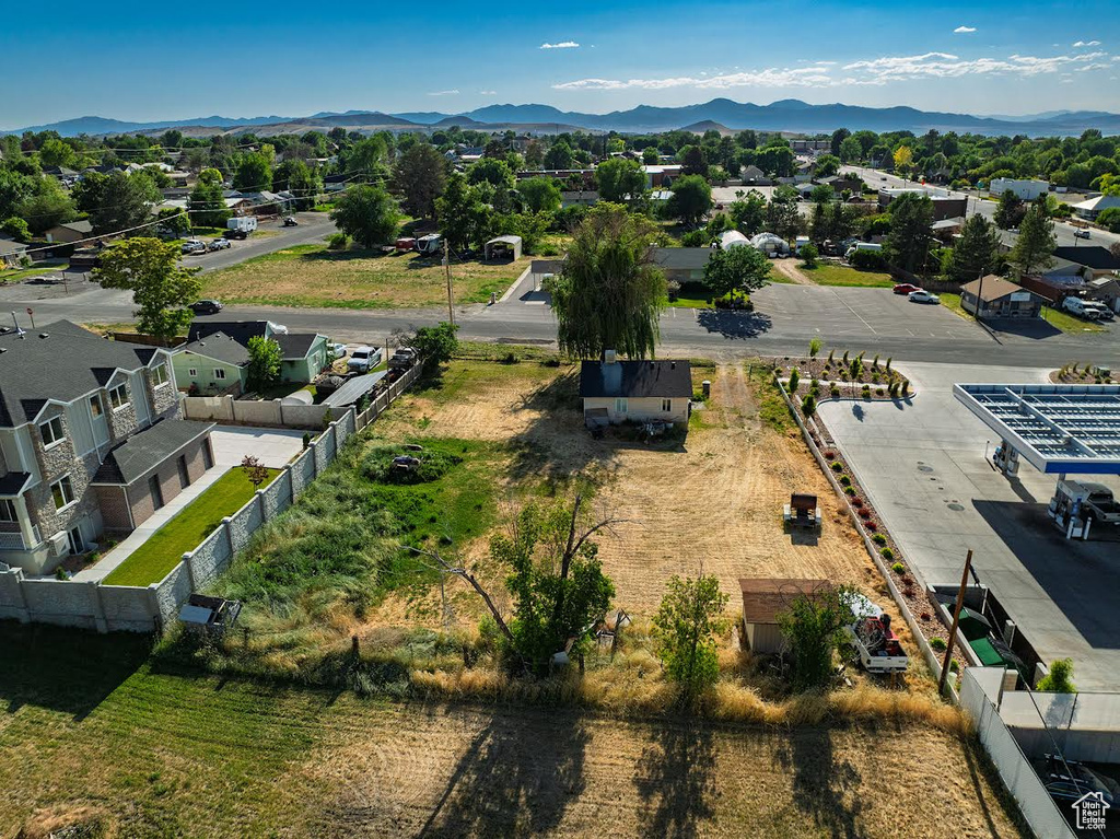 Aerial view of residential area featuring a mountainous background