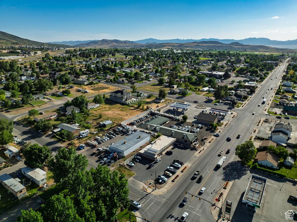 Aerial view of property's location with a mountain backdrop
