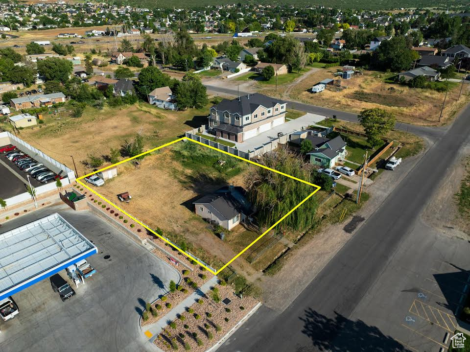 Aerial perspective of suburban area featuring property parcel outlined