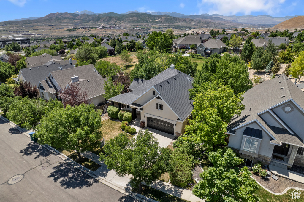 Aerial view of residential area featuring a mountainous background