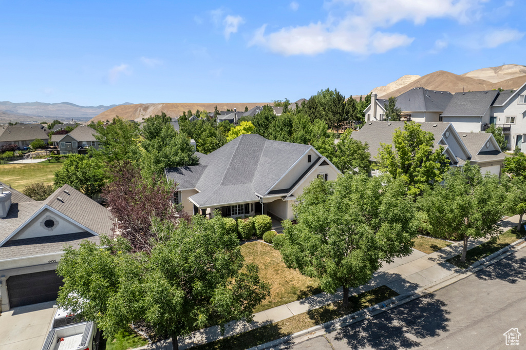 Aerial view of residential area featuring a mountainous background