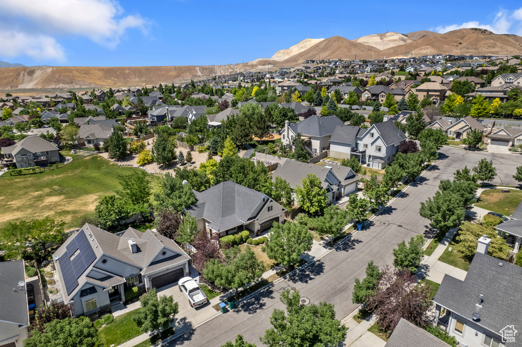Aerial perspective of suburban area featuring a mountain backdrop