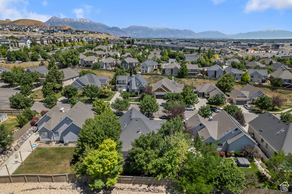 Aerial perspective of suburban area with a mountain backdrop
