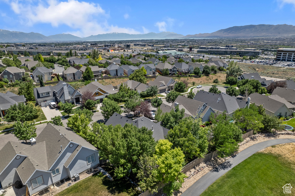Aerial perspective of suburban area featuring a mountain backdrop