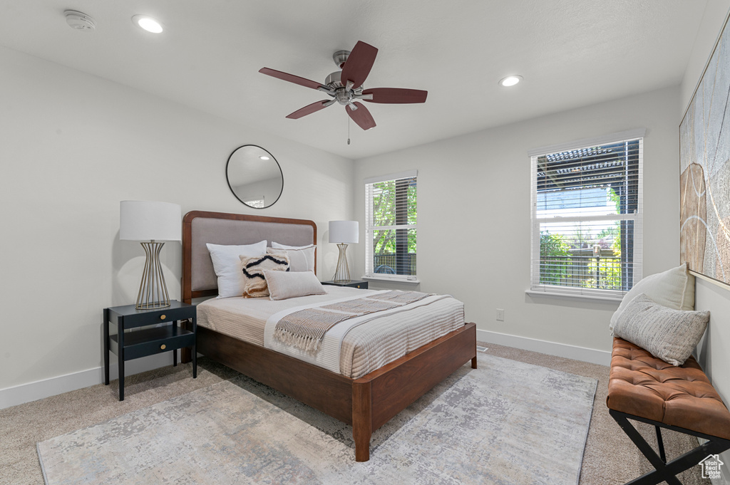 Bedroom featuring baseboards, light colored carpet, recessed lighting, and ceiling fan
