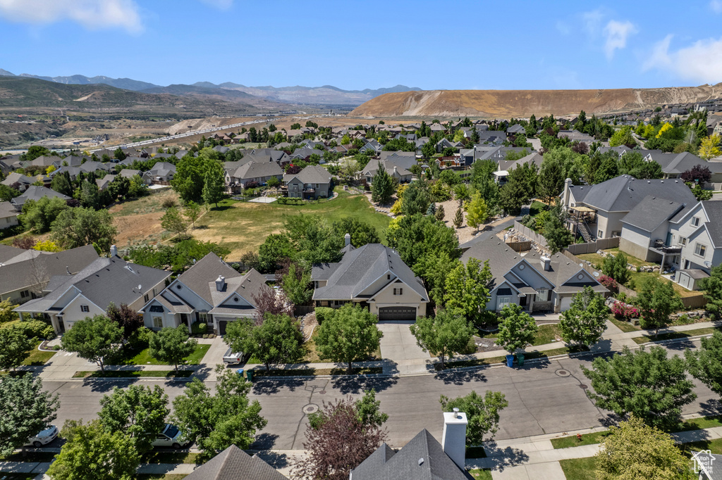 Aerial perspective of suburban area featuring a mountain backdrop