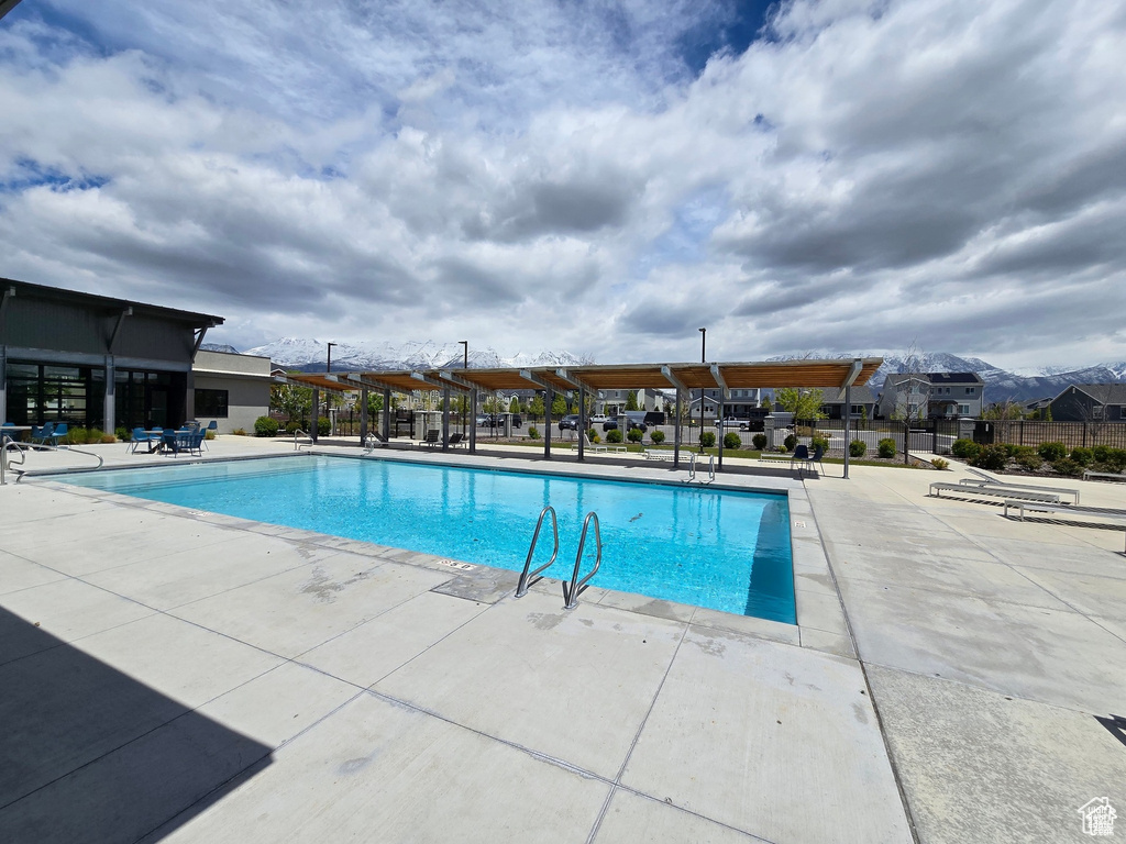 Community pool featuring a patio area