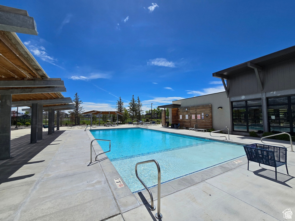 Community pool with a patio area
