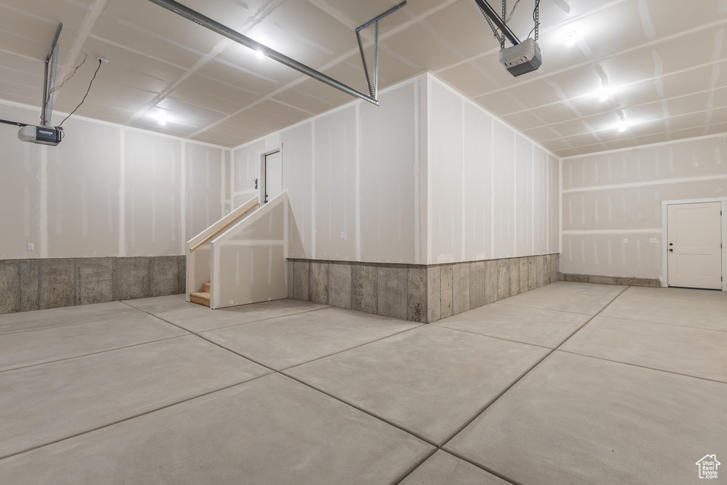 Garage featuring a garage door opener