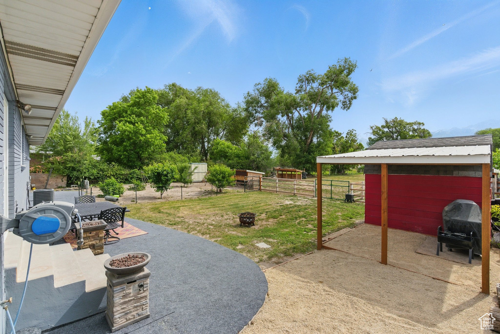 View of patio / terrace featuring outdoor dining space and a grill
