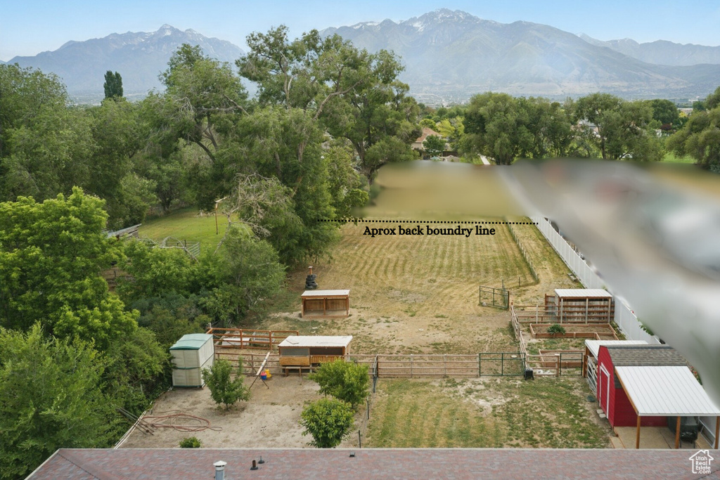 View of mountain backdrop featuring rural landscape