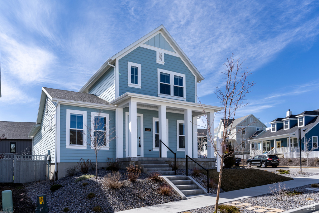 View of front of house featuring a porch and a residential view