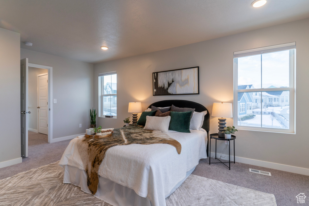 Bedroom featuring carpet, baseboards, and recessed lighting