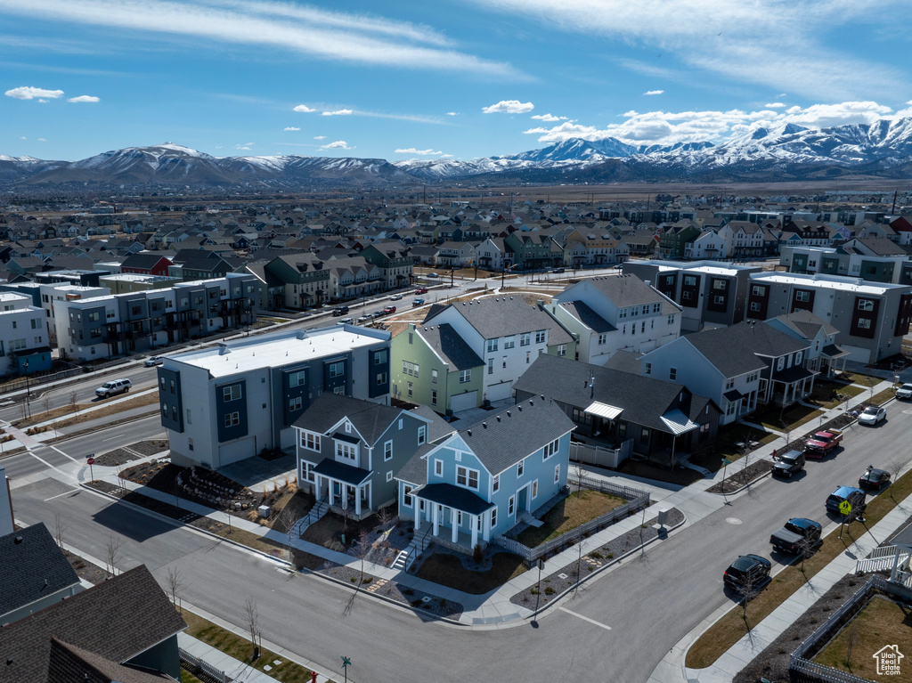 Aerial perspective of suburban area with a mountain backdrop