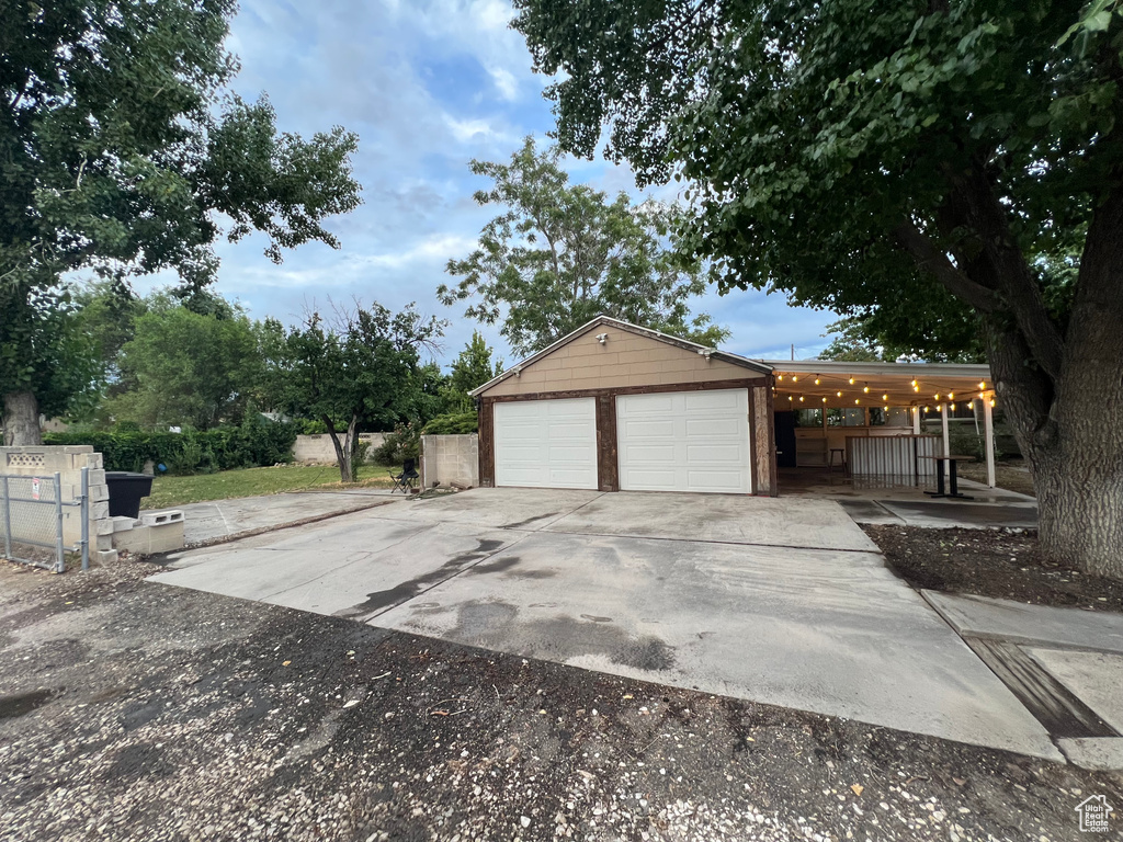 Garage with concrete driveway