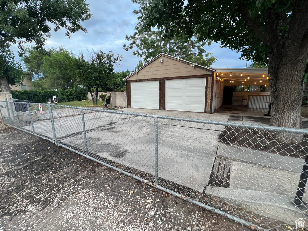 Garage featuring driveway