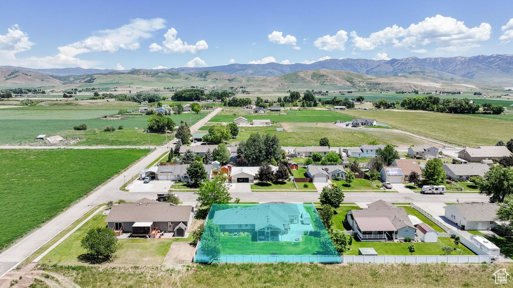 Aerial perspective of suburban area with a mountainous background