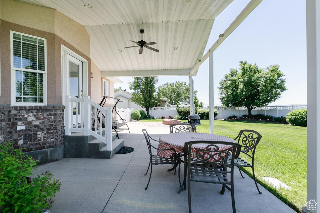 View of patio / terrace featuring outdoor dining area and ceiling fan