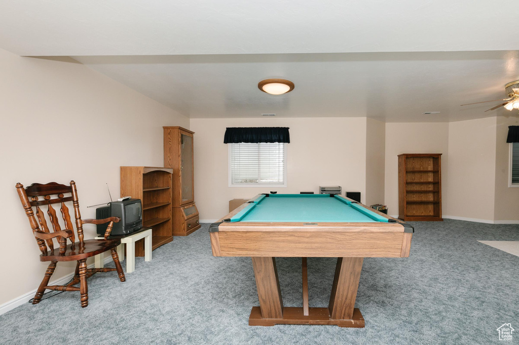 Game room featuring light colored carpet, pool table, and baseboards