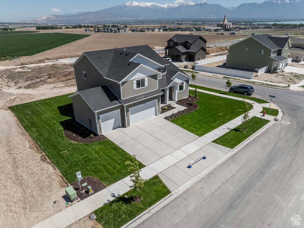 View of subject property with a mountain backdrop