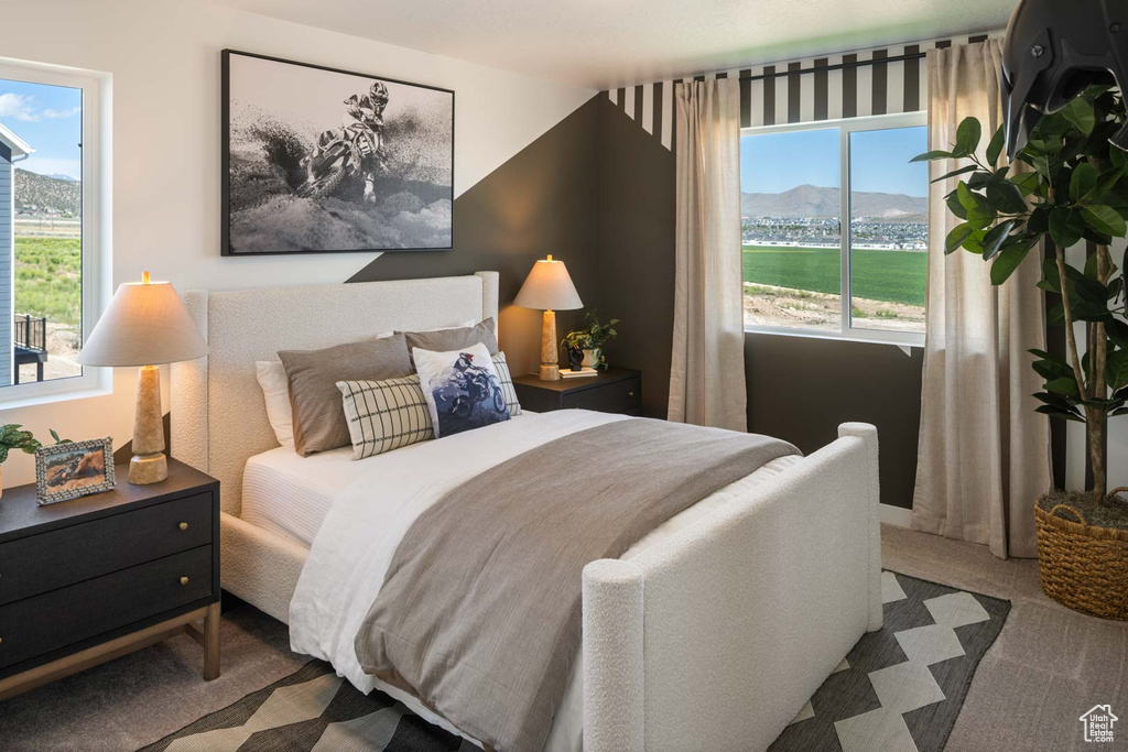 Carpeted bedroom featuring a mountain view