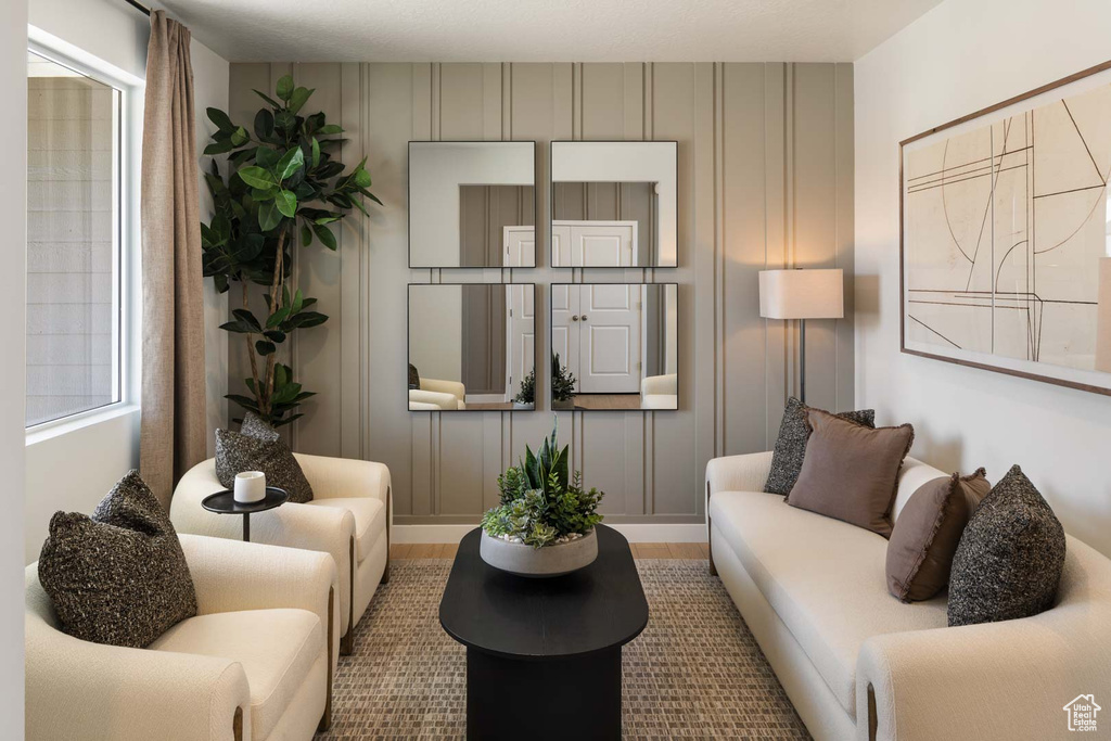 Living area featuring a decorative wall