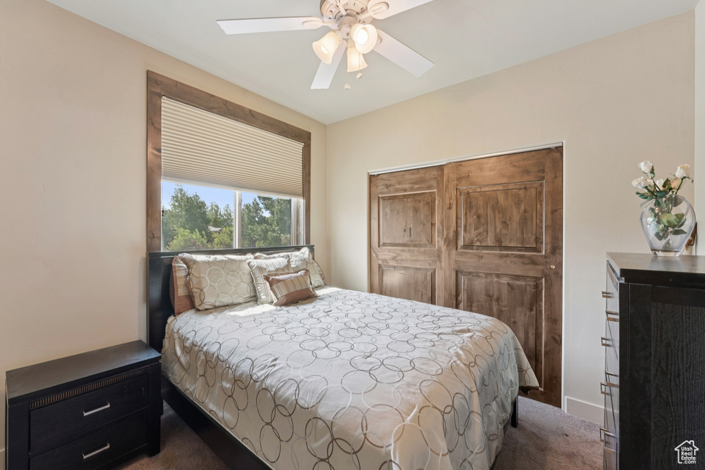 Bedroom with carpet flooring and a ceiling fan