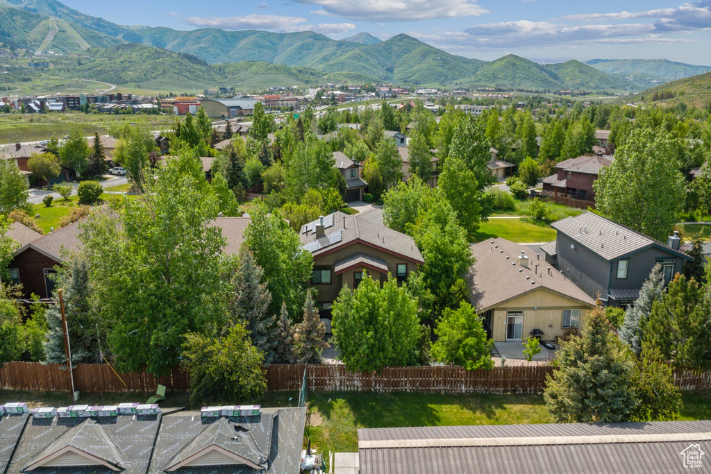 Aerial perspective of suburban area with a mountainous background