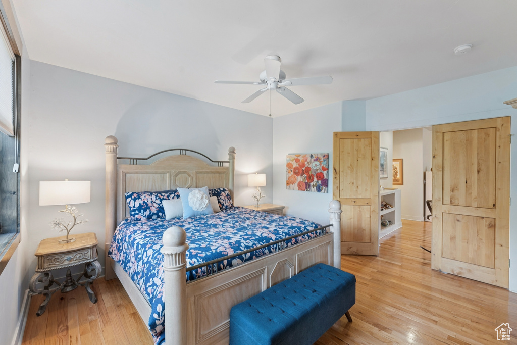 Bedroom with wood finished floors and a ceiling fan