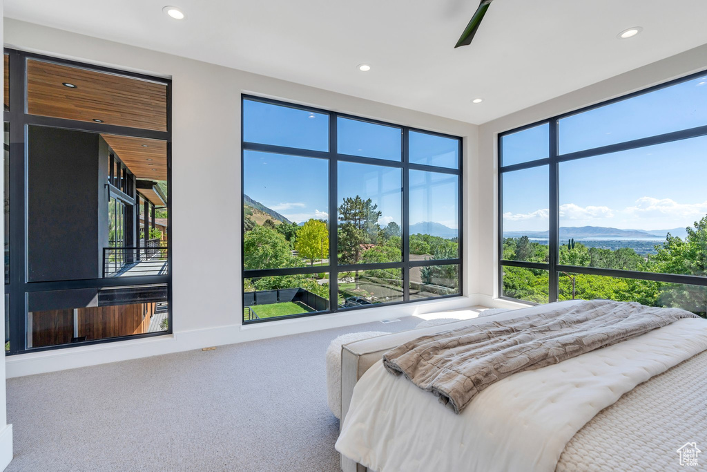 Carpeted bedroom with a mountain view, recessed lighting, and ceiling fan