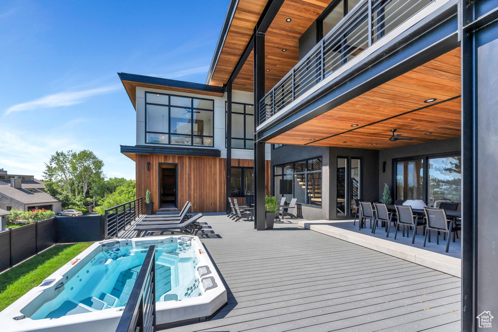 View of pool with outdoor dining area and a deck