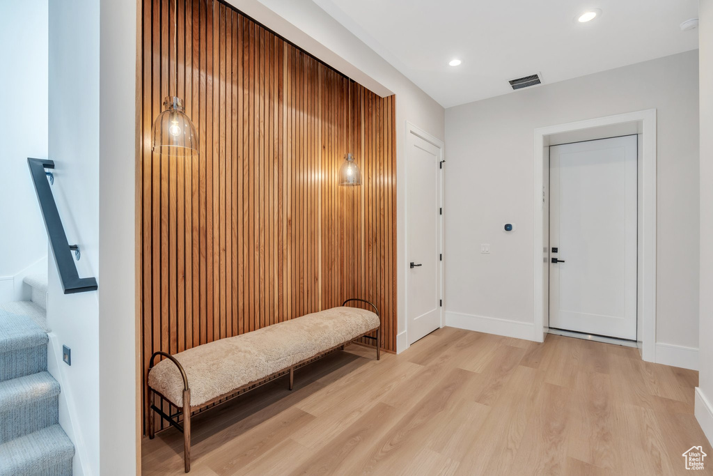 Entryway featuring light wood finished floors, baseboards, and recessed lighting