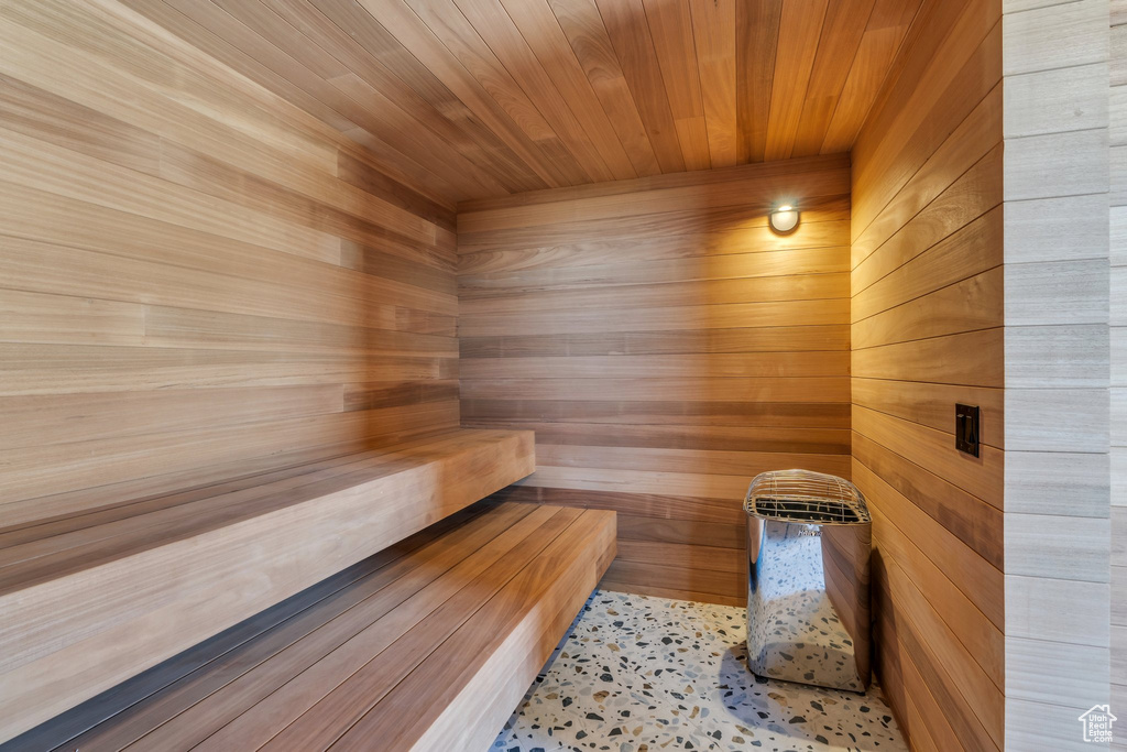 Relaxing sauna featuring wooden walls