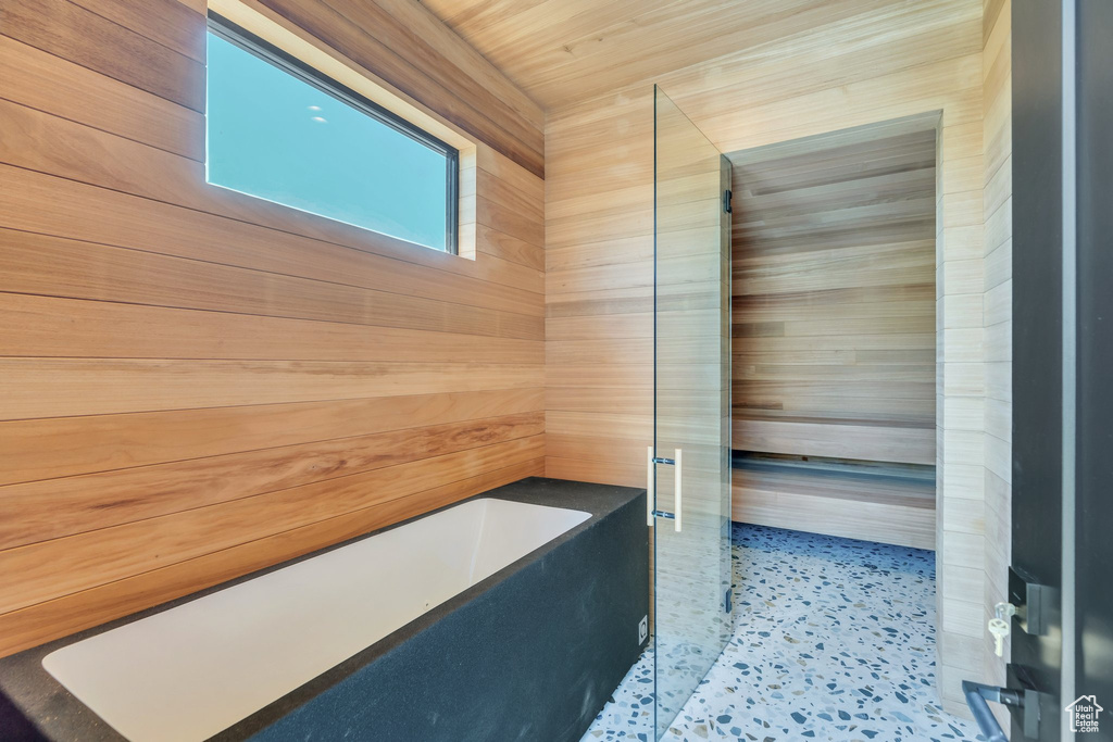 Bathroom with a bathtub and a shower with shower door