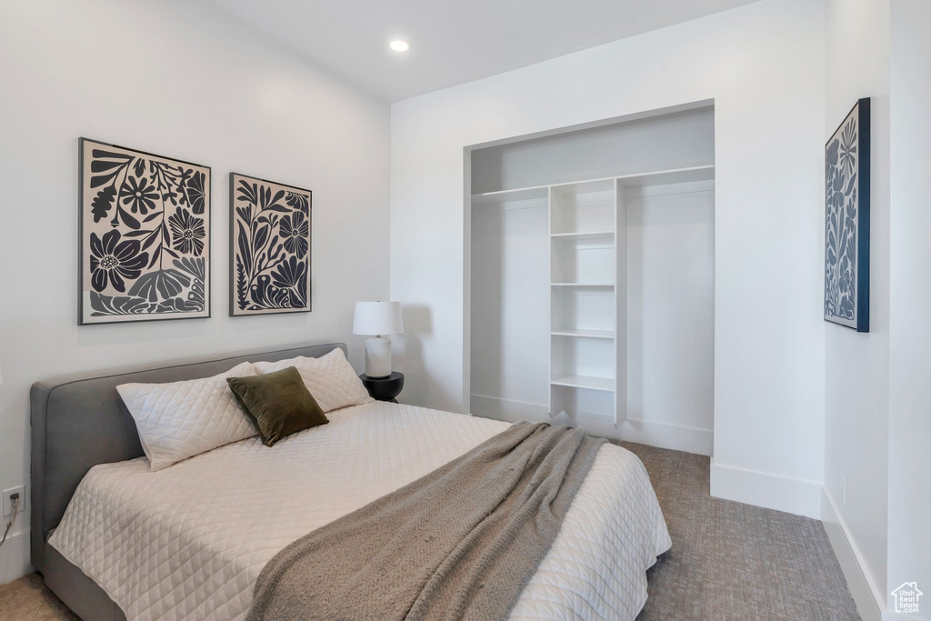 Bedroom with carpet floors, baseboards, a closet, and recessed lighting