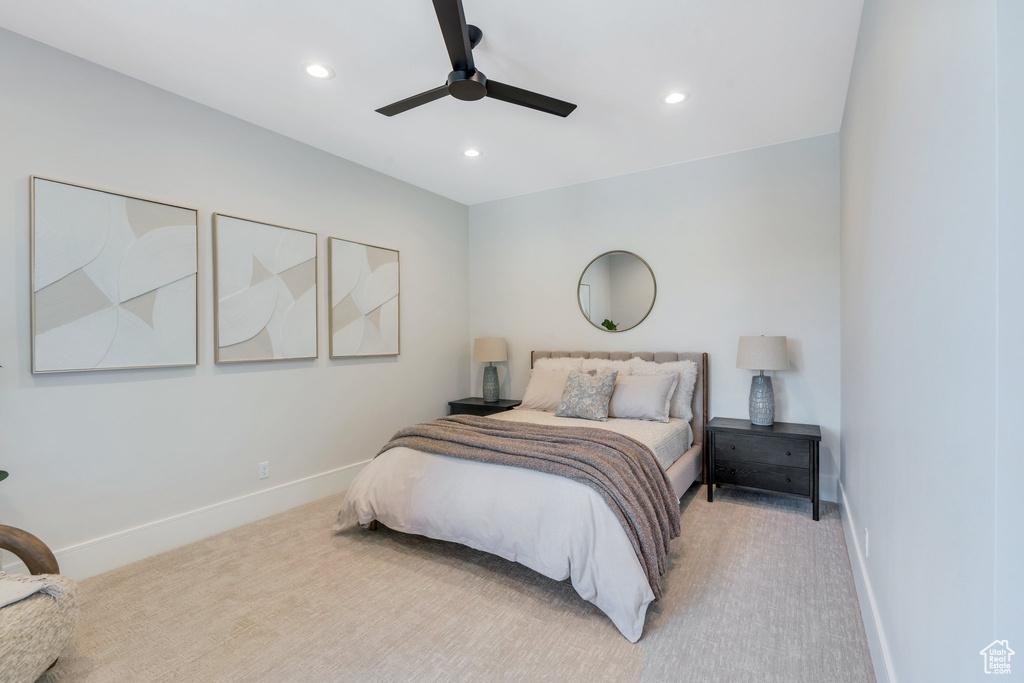 Bedroom featuring light carpet, baseboards, recessed lighting, and ceiling fan