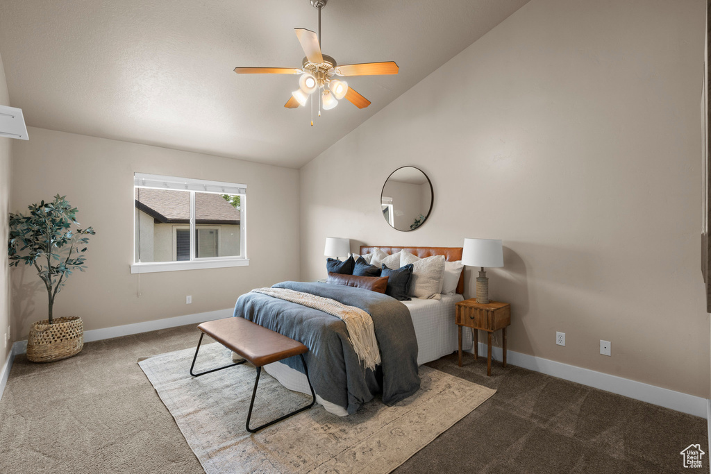 Bedroom featuring carpet flooring, vaulted ceiling, baseboards, and ceiling fan