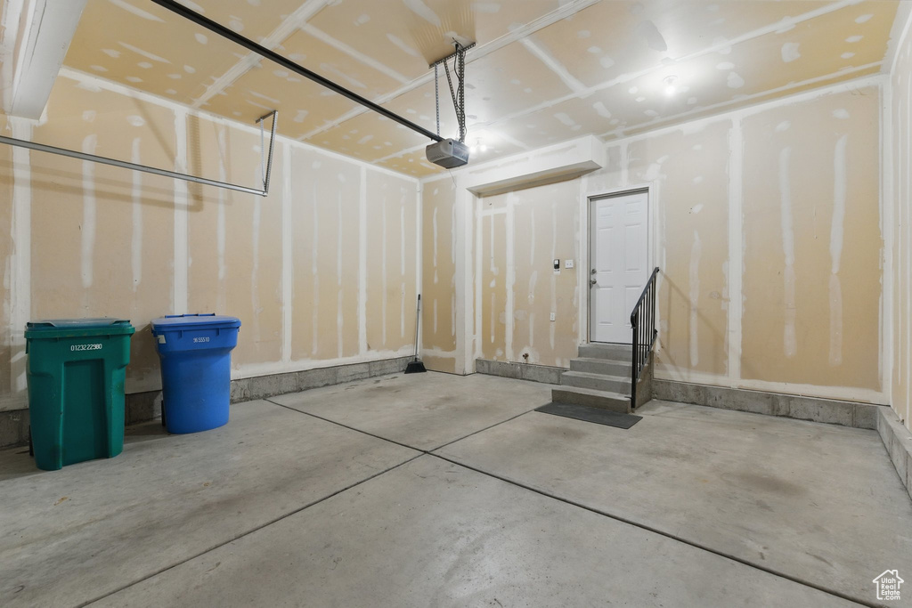 Garage featuring a garage door opener