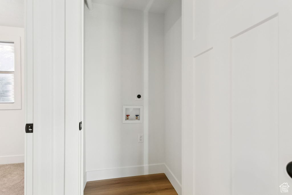 Laundry room with hookup for a washing machine, baseboards, and hookup for an electric dryer