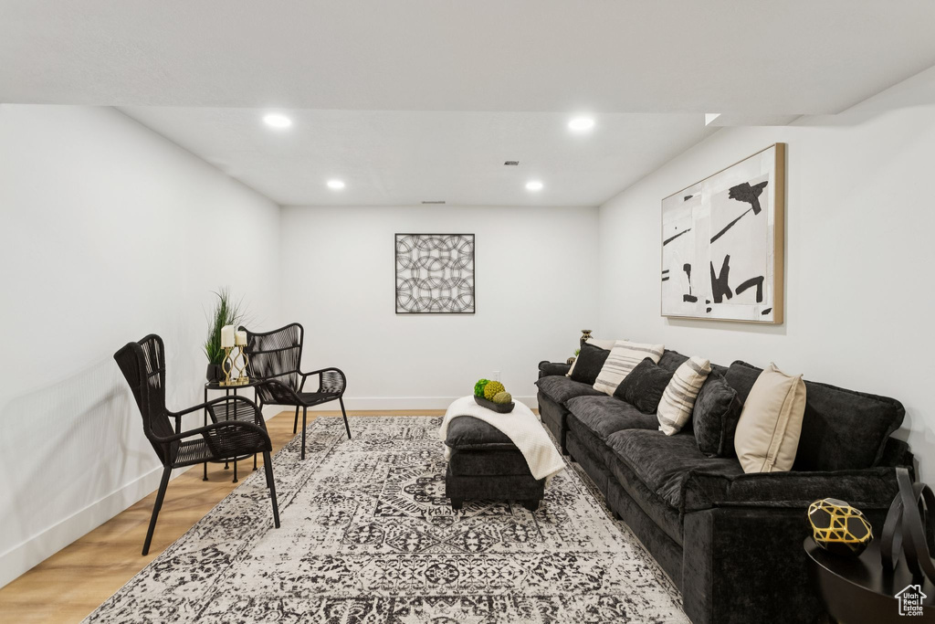 Living room featuring recessed lighting, baseboards, and wood finished floors