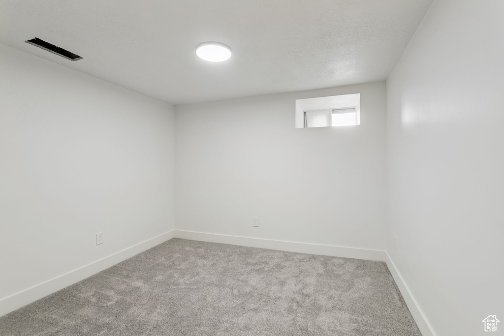Below grade area featuring carpet floors and baseboards