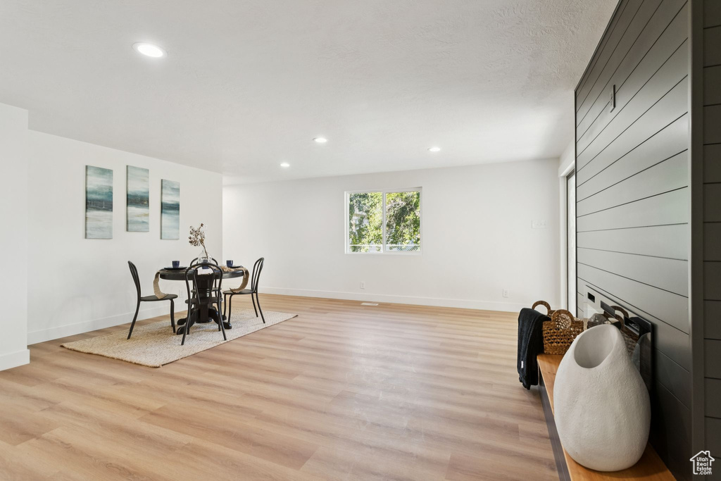 Dining room with recessed lighting, light wood-style flooring, and baseboards