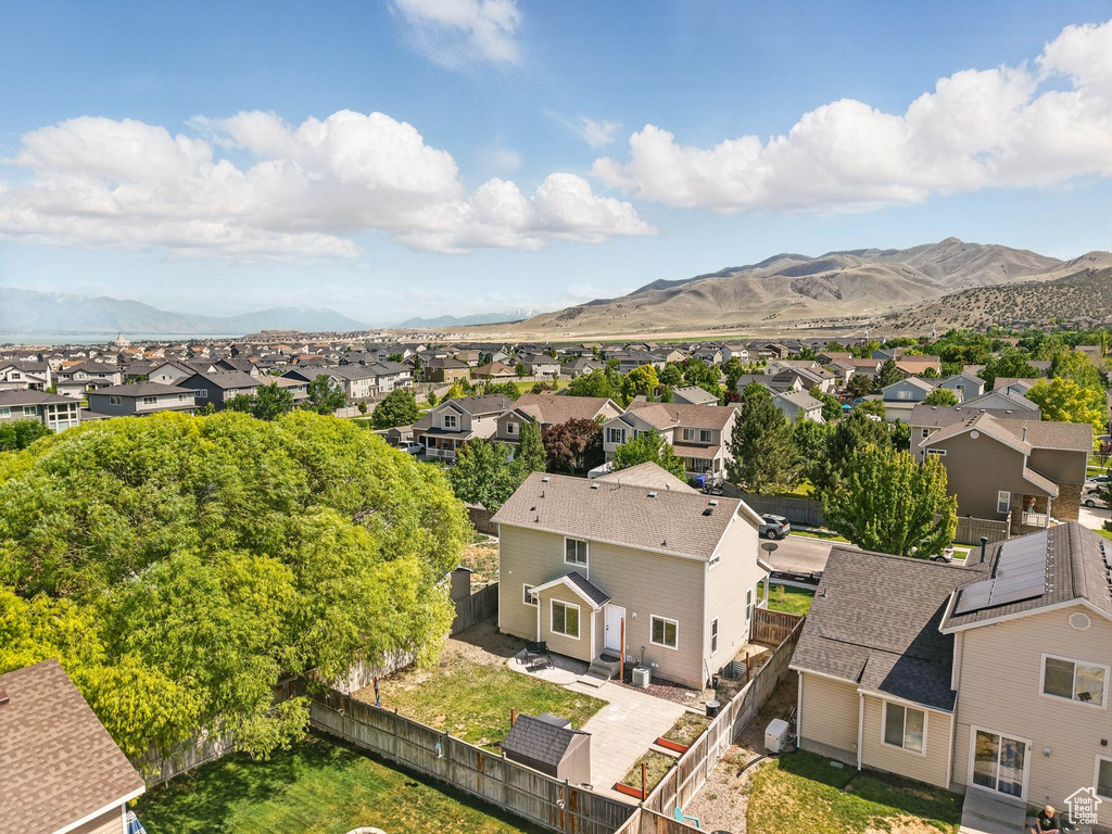 Aerial view of residential area with a mountainous background