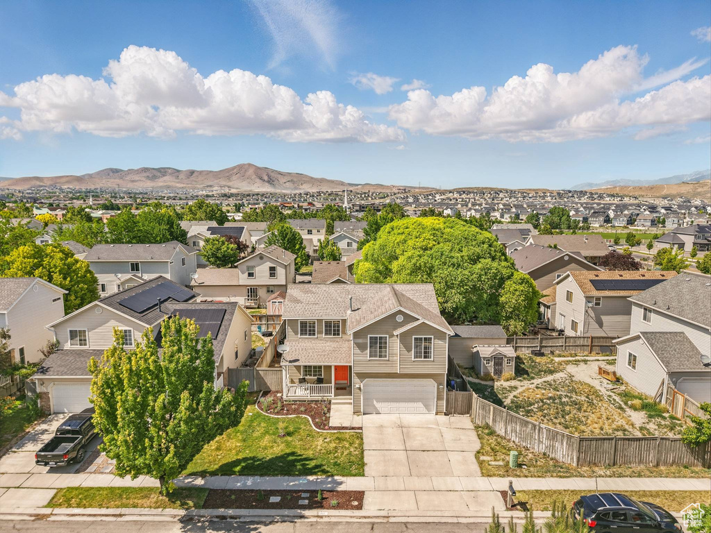 Aerial view of residential area with a mountainous background
